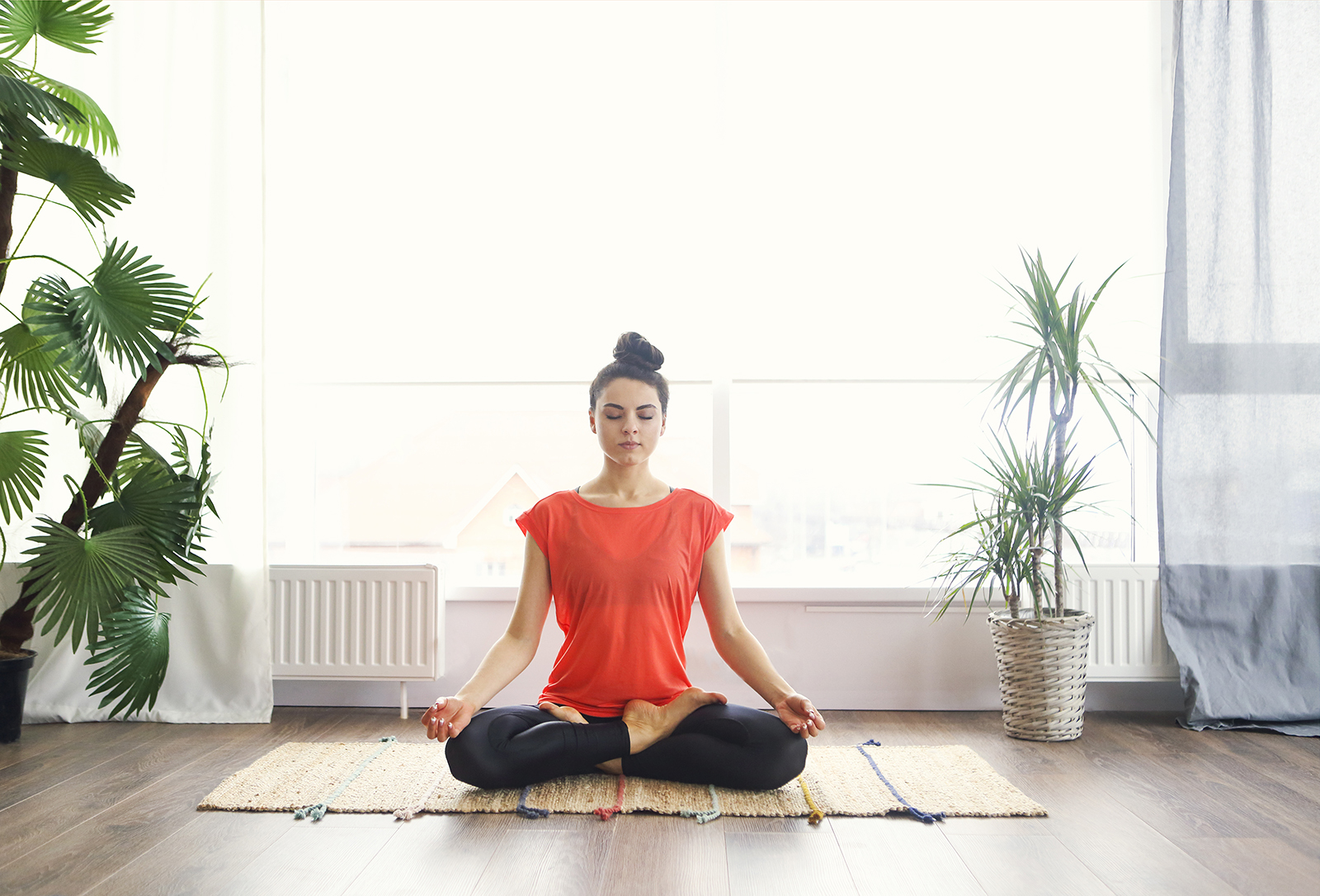 Woman meditating in lotus pose